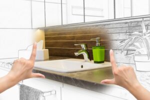 concept-drawing-of-new-bathroom-fixtures-with-hands-held-up-in-forefront