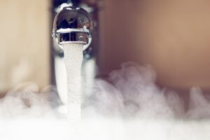 hot-steamy-water-coming-from-a-faucet